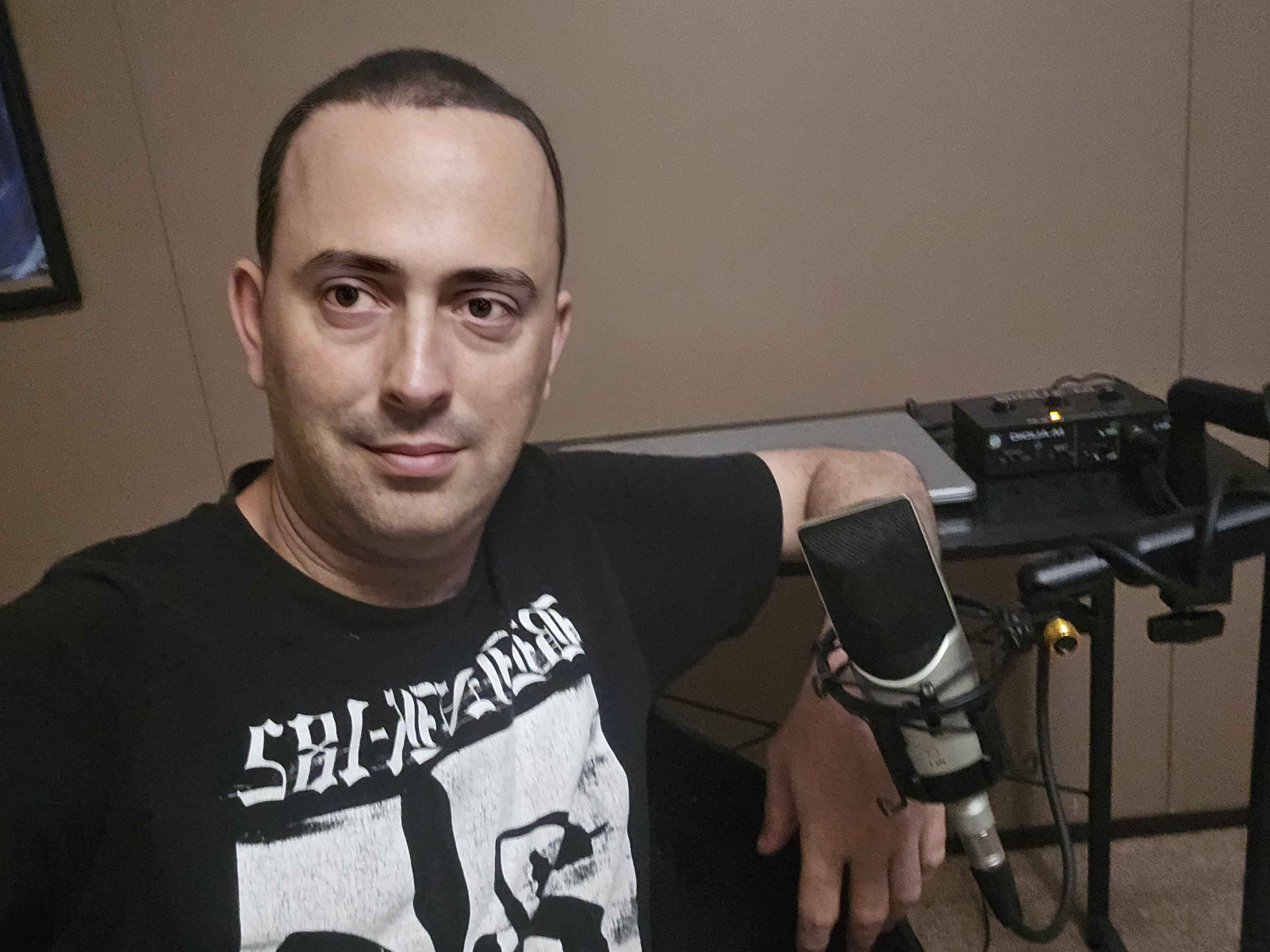 A photo of Jarred Thronhill recording audio